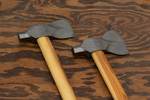 Two Bauer hatches laying on rustic wood surface made by Boss Hammer Co