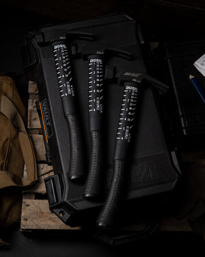 Fiberglass handle framing hammer on top of a 2x4 piece of wood showcasing the patented squaring system