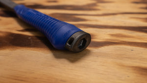 Closeup of steel hammer handle with built in saw socket